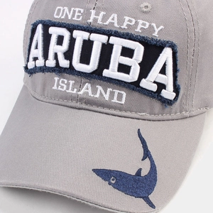 Gray washed cotton golf cap with Aruba embroidery and shark detail at 45-degree angle