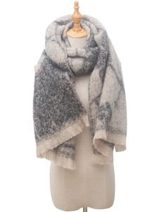 Detail of grey-beige jacquard floral scarf showing soft texture and tassel edges