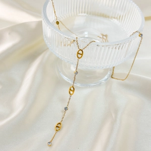 Classic 18K gold plated necklace featuring pig nose links and sparkling tassels