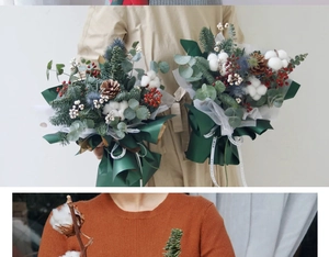 Detail of Christmas bouquet with cotton, pine cones, and berries in green wrapping