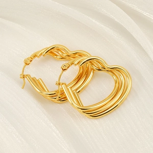 18k gold plated multi-layer wavy hoop earrings for women on white silk background