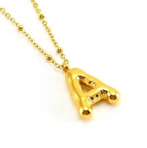 Detailed view of bubble initial A pendant in 18K gold-plated stainless steel with chain