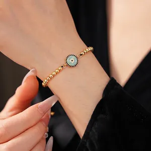 Adjustable 18K gold beaded evil eye bracelet with blue and white zircon for women
