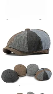 Detail of wool fabric texture and reinforced stitching on a vintage newsboy cap