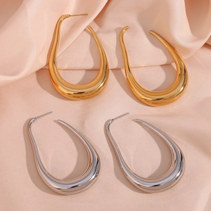 Polished hollow curve U-shaped earrings in gold and silver finish on silk