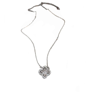 Silver clover necklace with sparkling white zircon stones on a clean white background