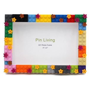 Close-up of DIY building block photo frame featuring colorful bricks and star decorations