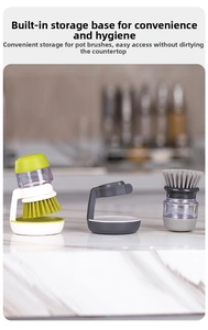 Kitchen cleaning brush set with soap dispenser and storage bases on marble countertop