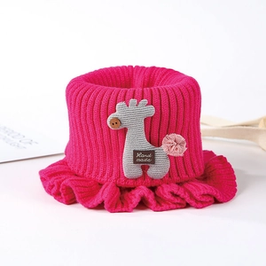 Detail of rose red knitted baby cowl featuring a cute grey giraffe and hand made label