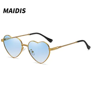 Golden heart-shaped metal sunglasses with light blue gradient lenses and twist texture
