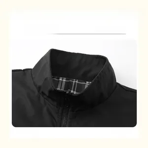 Detail view of the black jacket collar featuring a zipper and plaid fabric lining