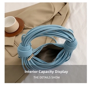 Top view of knotted shoulder bag showing spacious interior with metal zipper