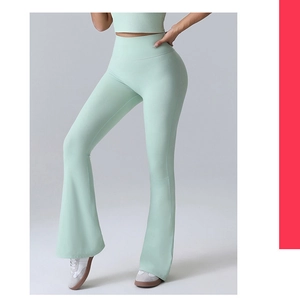 Detail of mint green high-waisted flare leggings showing stretch fabric and leg shape