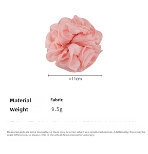 Detail view of 11cm pink floral fabric scrunchie with layered rose petal design