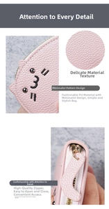 Detailed views of pink cat embroidery on lychee pattern PU leather wallet with zipper
