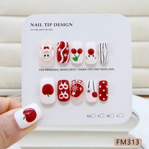 Press-on nails featuring red and white patterns of cherries, snowflakes and polka dots