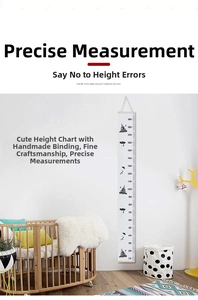 Detail of Nordic kids height chart with wood hanger and cartoon rocket patterns