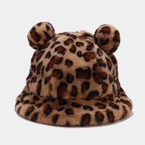 Detail of leopard print plush bucket hat with two cute pom-pom ears and soft faux fur texture
