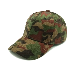 Detail of forest camouflage corduroy fabric on a curved brim outdoor baseball cap