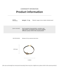 Detail of camellia choker necklace with zircon and faux pearl on black leather band