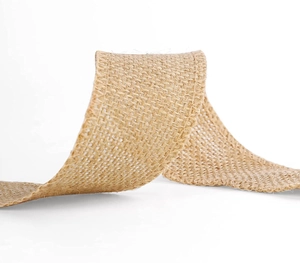 Macro shot of natural yellow jute ribbon with rustic S-curve texture for DIY crafts