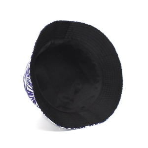 Detail of tropical palm leaf print bucket hat with black lining and stitching