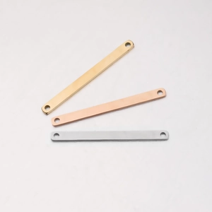 Close-up of dual-hole rectangular metal connectors in gold, silver, and rose gold