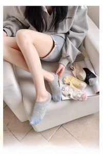 Detailed view of low-cut polka dot boat socks with non-slip silicone and cotton texture