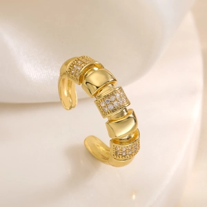 18K gold plated geometric open ring with sparkling cubic zirconia on white silk