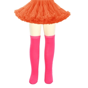 Detail of girls' knit over-knee socks in rose red with an orange layered tutu skirt