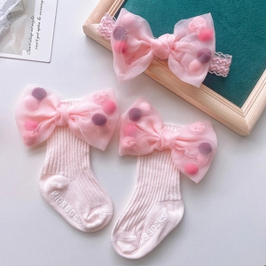 Pink infant headband and non-slip socks set with large mesh bow and soft cotton fabric