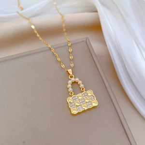 Elegant gold titanium steel necklace with luxury pearl handbag pendant and sparkly crystals