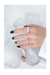 Detailed view of S925 silver rings with large crystal and twisted zircon bands on ice