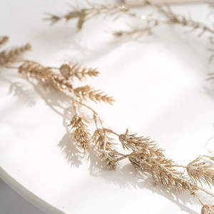 Champagne gold pine needle garland with shimmering glitter for Christmas decor