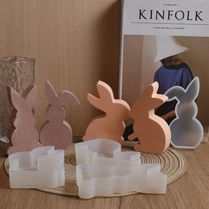 Macro shot of 3D rabbit silicone molds and resin cast bunnies for Easter DIY crafts