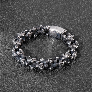 Close-up of vintage skull bracelet in aged silver with a wide industrial plug buckle