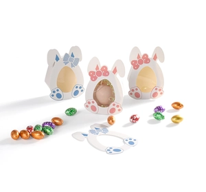 Detail of Easter bunny paper candy boxes with egg-shaped clear windows and bow accents