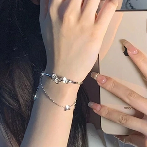 Elegant silver butterfly double-layer bangle and chain bracelet worn on wrist