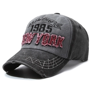 Vintage dark gray washed baseball cap with 1985 New York embroidery and distressed brim
