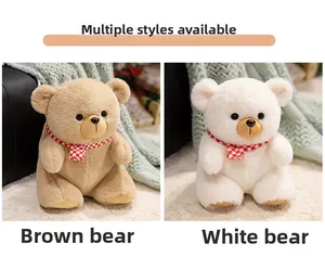 Detail of plush teddy bear set in brown and white with classic checkered scarves