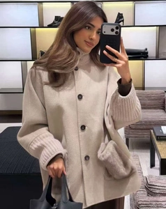 Oatmeal wool coat detail with knit stitching cuffs and large plush pockets