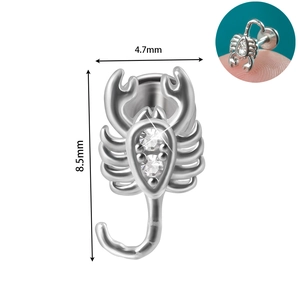 Macro detail of scorpion ear stud with dimensions 4.7mm by 8.5mm and white zircon stones
