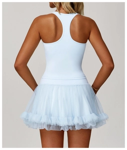 Detail view of the racerback design and layered mesh tutu on light blue sports dress
