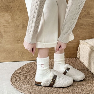 Winter plush mule shoes with brown buckle and warm fuzzy socks with pink bow decoration