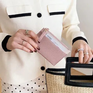 Pink lychee grain leather wallet with multi-card slots and secure zipper closure