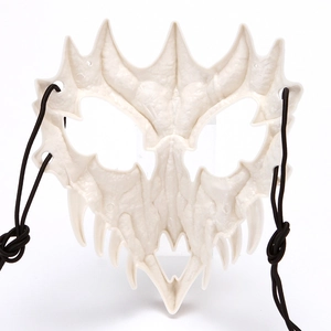 Close-up of skeleton monster mask showing bone texture and black elastic head strap