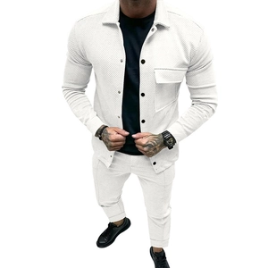 Detailed view of white men's corduroy two-piece set featuring vertical ribbed fabric texture