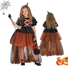 Detail of girl witch costume featuring orange sequin bodice and black mesh layered tulle tail