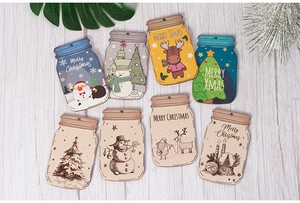 Detailed view of eight jar-shaped wooden Christmas tags with colorful festive patterns