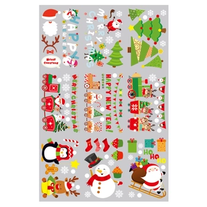 Close-up of festive Christmas window stickers with Santa, snowman and reindeer motifs